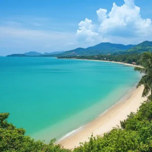 Scenic tropical beach in Thailand with turquoise waters, lush greenery, and blue skies – a perfect destination for relaxation and recovery after stem cell therapy