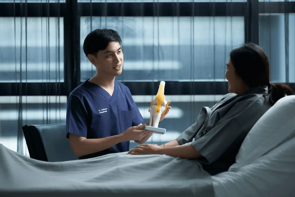 Vega Clinic Doctor Discussing Stem Cell Recovery Process with a patient in bed, just after treatment.