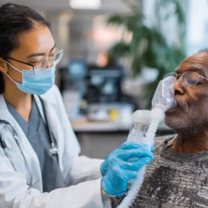 Stem Cell Doctor treating a patient suffering from COPD with a Stem Cell Nebulizer